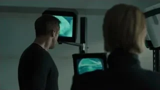 Man and woman looking at face X-ray monitors — Blade Runner 2049