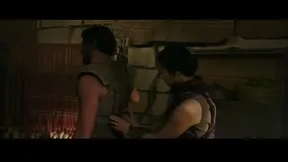 Man and woman in dimly lit stone room — Gladiator 2