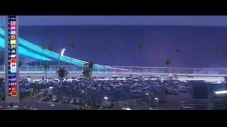 Cars racing on track at night — Cars 3
