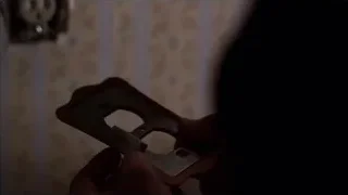 Person's hand holding a smartphone — Breaking Bad