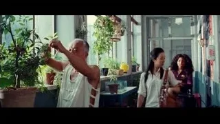 elderly man pruning potted plant — The Karate Kid