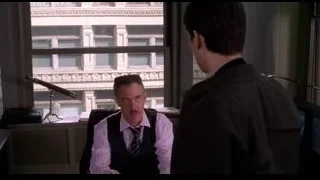 two men conversing at office desk — Spider Man