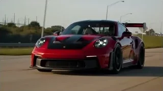 red sports car driving fast on highway — Sports Cars