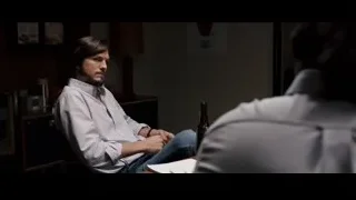 man with beer and notebook at desk — Jobs