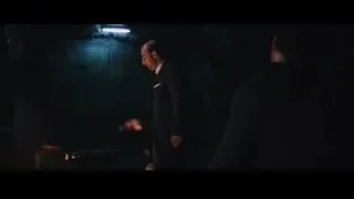 man in dark room holding bottle — Iron Man