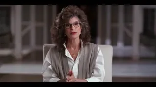 middle-aged woman sitting in chair by window — The Social Dilemma