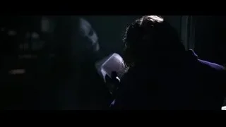 person sitting on bench reading book — Batman: The Dark Knight