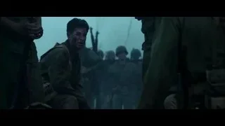 Man sitting with head in hands among soldiers — Hacksaw Ridge