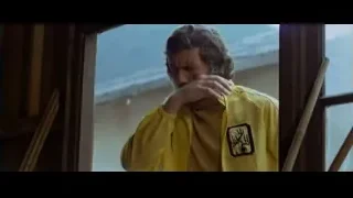 man in yellow jacket by window — Bruce Lee: Enter The Dragon