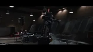 man with gun and robot in garage — Iron Man 3