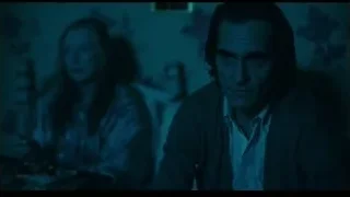 man looking at distressed woman — Joker