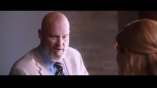 Bald man deep in thought, woman attentive — Iron Man