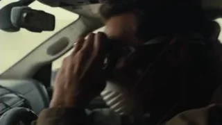 Man driving car holding phone — Interstellar