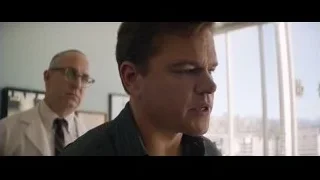 man in office looking at city skyline — Ford v Ferrari