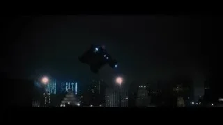 City skyline at night with spaceship — Batman: The Dark Knight Rises