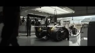 People working on Formula One car in garage — F1