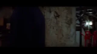 two men walking through dark stone tunnel — Bruce Lee: Enter The Dragon