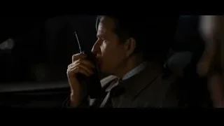 man holding walkie-talkie in dark room — Batman: The Dark Knight Rises