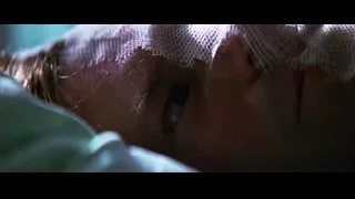 person with eyes closed on hospital bed — Batman: The Dark Knight
