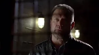 man in leather jacket in dimly lit room — Breaking Bad
