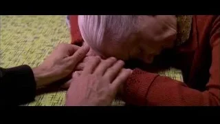 elderly woman resting head on hands — Spider Man 2