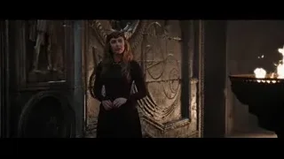 Woman with crown by stone wall and fire — Doctor Strange 2