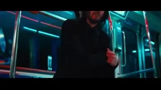 Man standing in subway train — John Wick: Chapter 4
