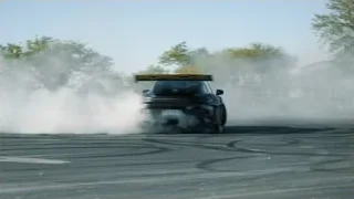 black Porsche drifting on race track — Sports Cars