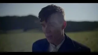 Man kneeling in grassy field — Peaky Blinders