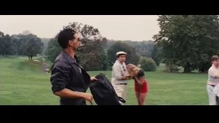 Two men conversing on golf course — The Wolf Of Wall Street