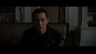 Man sitting in chair in dimly lit room — Batman: The Dark Knight Rises