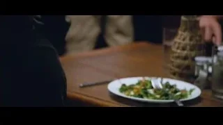 men in kitchen with red countertop — The Big Short