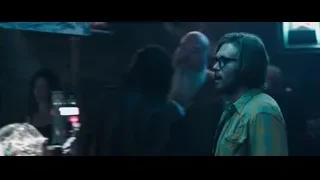 Three people in dimly lit room — Deadpool