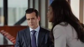 man and woman conversing in office — Suits