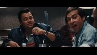 man in leather jacket at restaurant — The Wolf Of Wall Street