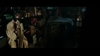 Man in suit and top hat in cluttered room — Now You See Me 2