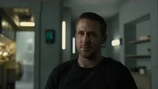 Man deep in thought in dim room — Blade Runner 2049