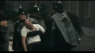 Men in riot gear on city street — Peaky Blinders
