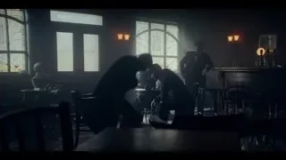 group of people in dimly lit bar — Peaky Blinders