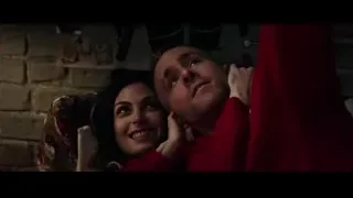 Man and woman in red pajamas on bed — Deadpool