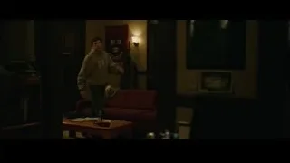 Man in GAP sweatshirt in dimly lit room — The Social Network