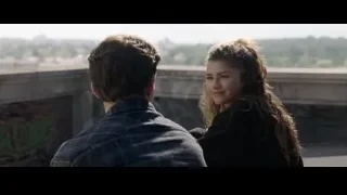 young couple sitting on bridge overlooking city — Spiderman: No Way Home