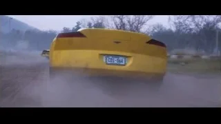 yellow sports car driving on dirt track — Cars 3