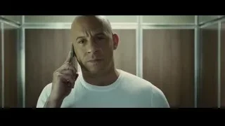 bald man talking on phone in room — Furious Seven