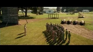 men in uniform standing in grassy field — Hacksaw Ridge