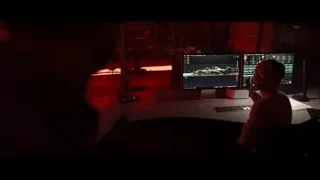 Person working at desk with multiple monitors — F1