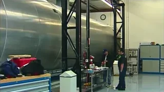 Metal stairs in industrial space with tank — Elon Musk: Return to Space