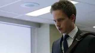 young man in suit standing in office — Suits