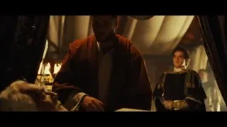 man in red robe cutting paper in mirror — Gladiator