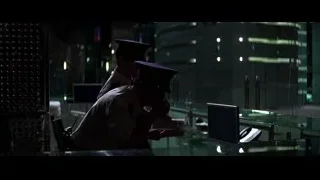 two men working on computer in dark room — Batman: The Dark Knight